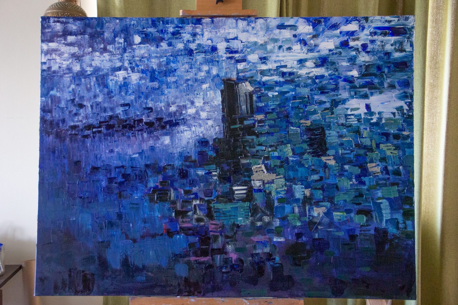 Stand-in process photograph, WIP001: an easel holding a painting in a studio. Not the final Tigerström #1 shot.